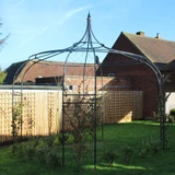 Gothic Gazebo with lattice installed in lawn in large yard