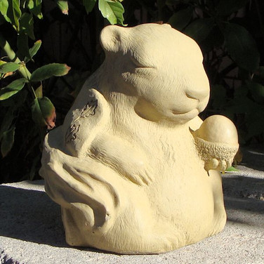 Meditating Squirrel shown in old stone