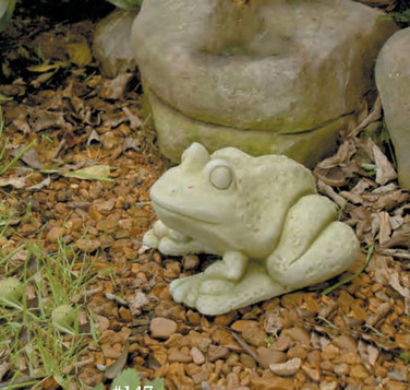 Frog Statue shown in natural moss