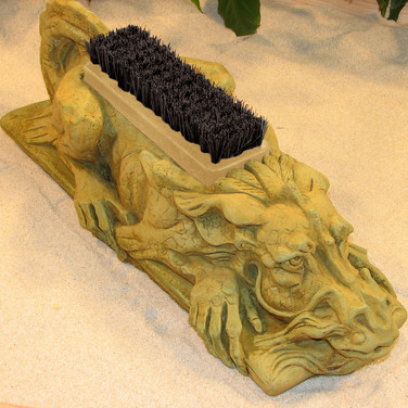 cast stone dragon bootbrush in weathered bronze