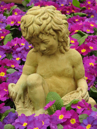 Cherub statue with a gardening theme