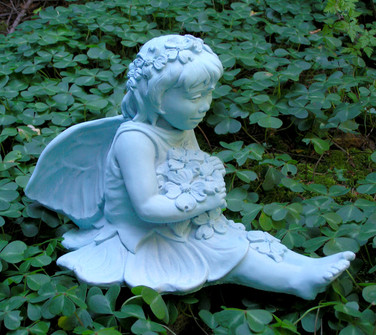 Fairy statue with dogwood flower theme