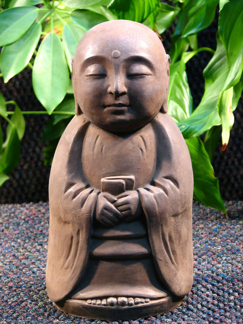 Standing Jizo statue in dark stain