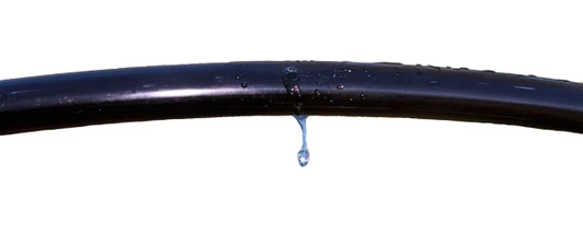 DripWorks 1/2" Emitter Drip Line Irrigation Tubing 12" Spacing 1 GPH showing water droplet