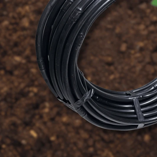 DripWorks Irritec 1/2" PC Emitter Tubing 24" Spacing rolled out on soil