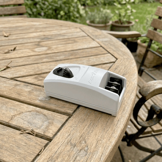 Rain Bird 3-Station Expansion Module lying flat on a wooden table MPN: F38200