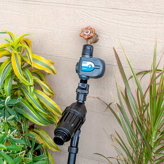 DIG Bluetooth Hose End Timer installed on outdoor spigot MPN: BOHE-BT