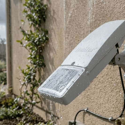 Hunter Node-BT Solar Panel wall-mounted installation on stucco exterior MPN: SPNODEBT