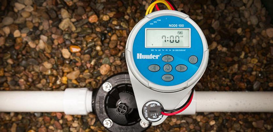 Hunter Node waterproof controller installed on pipe in trench MPN: NODE100