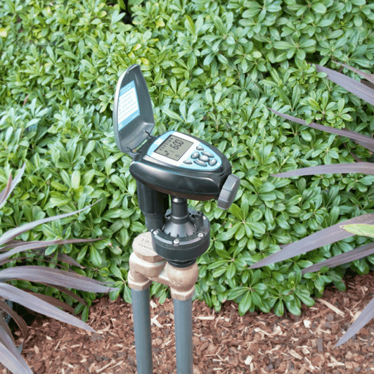 DIG 710A Battery Controller on anti-siphon valve in an outdoor garden MPN: 710A-000