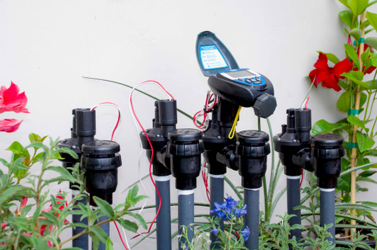 DIG Battery Operated Controller installed on garden valve manifold open lid MPN: 7X0A-000