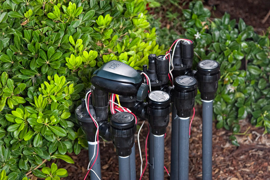 DIG Battery Operated Controller installed on garden valve manifold closed lid MPN: 7X0A-000