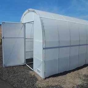 Side view of an empty Solexx Oasis Greenhouse with the front door open.