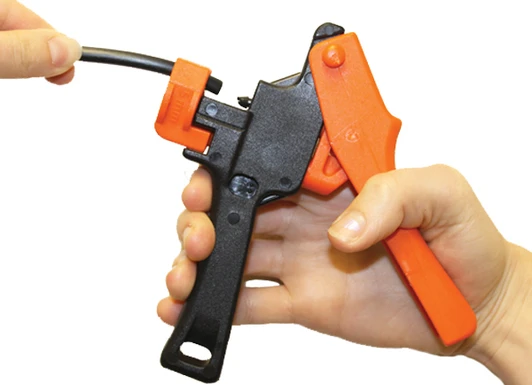 DripWorks Miracle Insert Tool being used to connect micro tubing to a barb