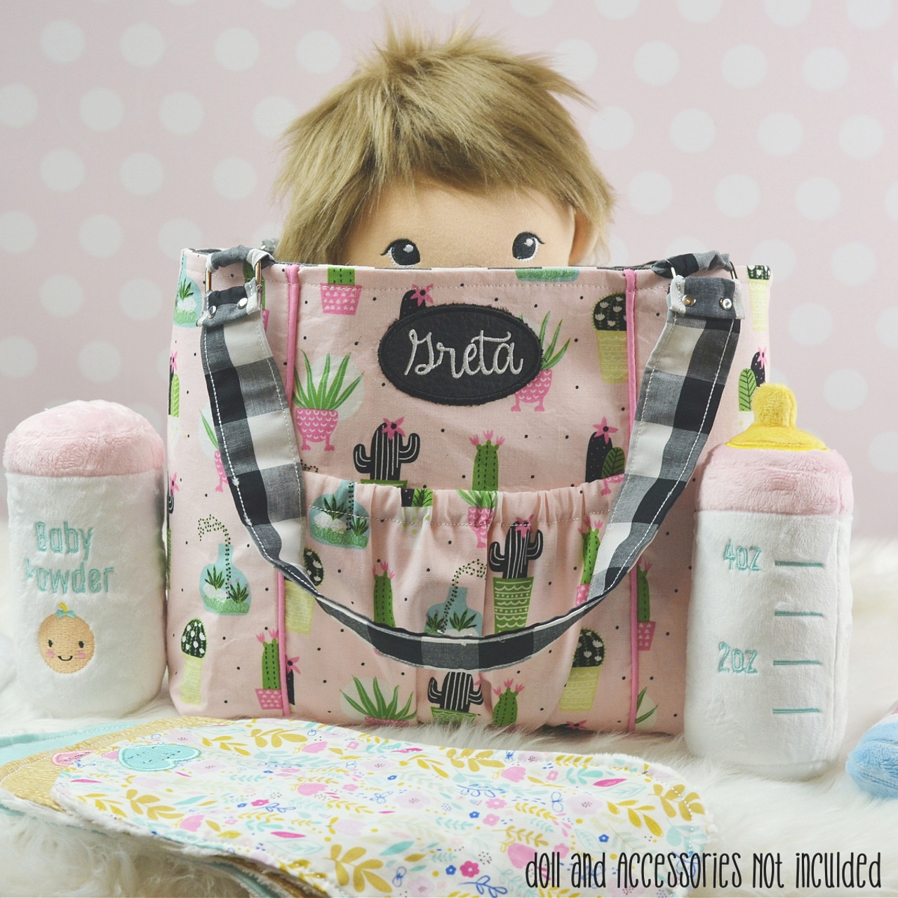 Changing bag with appliques and dummy holder
