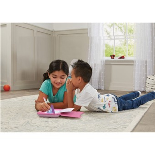 children writing in Vtech notebook children writing in Vtech notebook