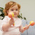 Girl playing Tiger Tribe maracas