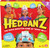 Spin Master Hedbanz 3rd Edition guessing game box featuring children wearing headbands and asking what am I questions