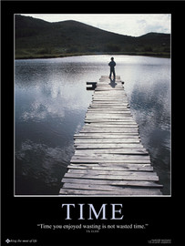 Time wasting poster image of man standing on dock looking at mountains and water