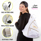 Lifestyle photo of Jorja Johnson wearing the Franklin Sling Bag, white with gold trim. displays main features of bag