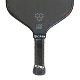 Detail view of the five inch long handle and perforated comfort grip of the Midweight CRBN-2X Power Series Paddle