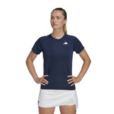 Lifestyle view of the Women's adidas Club Tee in the color Collegiate Navy.