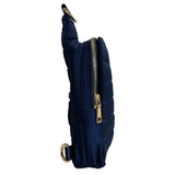 Side view of ah.dorned Eliza Quilted Puffy Sling Bag in the color Navy.