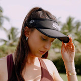 Female model wearing the Selkirk x Parris Todd Visor in the color black.