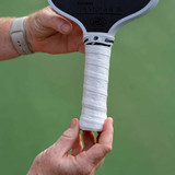 View of GAMMA PureTac Pickleball Overgrip in the color white applied to Paddle.