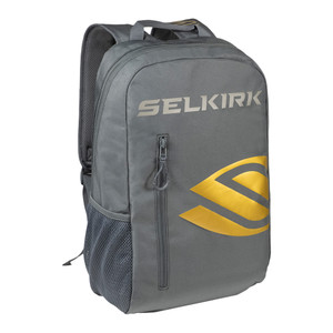 Day Backpack by Selkirk shown in color Regal. Featuring a gold Selkirk brand design on a dark grey background and measures sixteen inches tall and thirteen inches wide