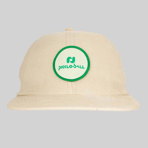 Front view of Heritage Pickle-ball Circle Patch Corduroy Hat in the color Butter.