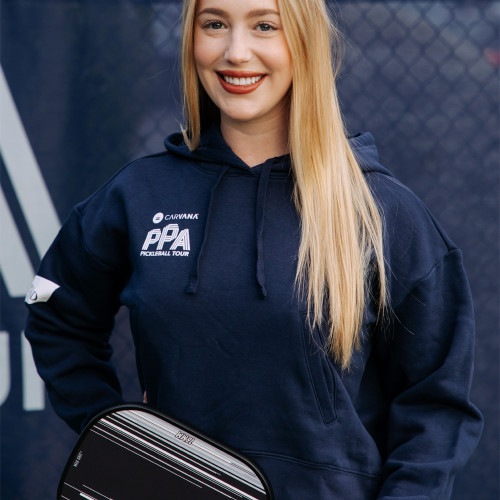 Model wearing the navy PPA FILA Marina Women's Hoodie with white logo on left chest. Sizes XS-XL