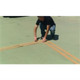 Man setting up Pickleball Court Stencil components