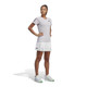Lifestyle view of Woman's adidas Club Pleatskirt in the color White.