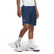 Lifestyle view of the 7" adidas club shorts for men, in the color Collegiate Navy.