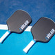 Overhead view of the 14mm and 16mm Volair Mach 2 Carbon Fiber Pickleball Paddles on a court