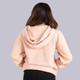 Back view of the Pickleball Central Heritage Pickle-ball Groovy Front Logo Unisex Hoodie on a female model in the color Dusty Pink.