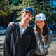 Lifestyle view of erne Unstructured Cord 5 Panel Hat.(Two models posing next to each other)