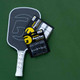 Front view of GAMMA PureTac Pickleball Overgrip in the colors black & white side-by-side.