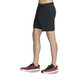 Side view of the Skechers Go STRETCH Ultra 7" Shorts in the color Bold Black.