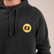 Close-up of the Heritage Pickle-ball Paddle Hooded Sweatshirt logo.