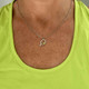 View of the Born to Rally Color Pop Pickleball Necklace in the color Green on model.