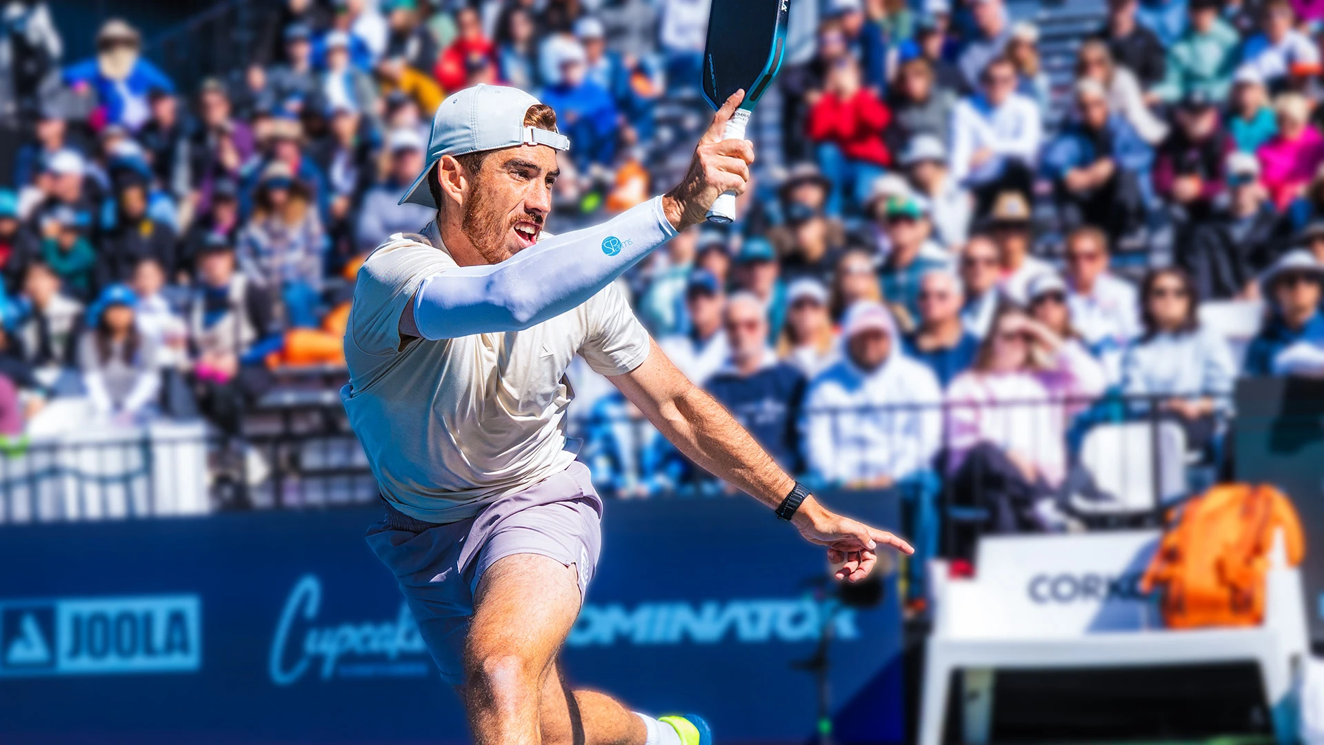 Pickleball player wearing SParms arm sleeves for UPF 50+ sun protection