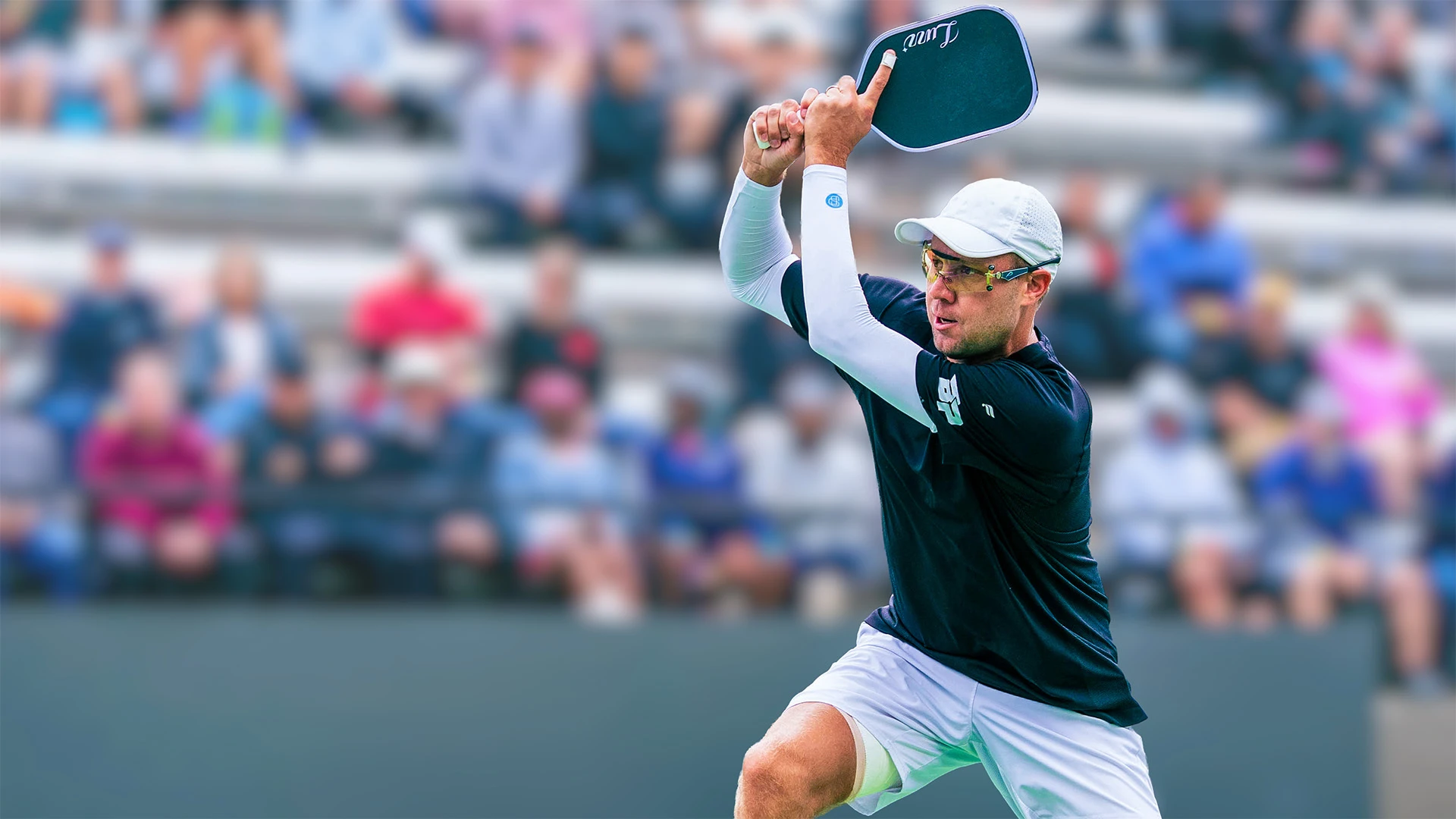 Chris Haworth playing pickleball outdoors while wearing SParms sun protection gear
