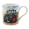 Green tractor coffee mug on a field on a sunny day