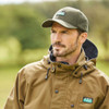 Man wearing the Ridgeline Monsoon Classic Baseball cap in Olive with the Ridgeline Monsoon Smock
