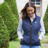 Walker wearing Ridgeline Monarch gilet with a check shirt and jeans