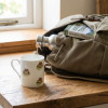 Walking boot china mug with rucksack on worktop