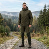 Man wearing Game Mens Kendal Waterproof Jacket walking on a countryside trail in wet outdoor conditions