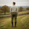 Game Men's Ascot Derby Tweed Breeks rear view worn with shooting socks in a countryside setting, traditional men's shooting attire.